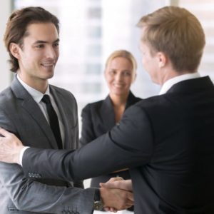 Two businessmen handshaking