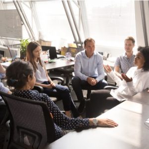 Female leader speaking to team interns