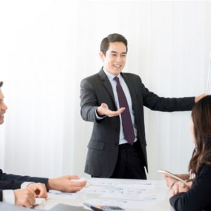 Businessman as a meeting leader giving presentation in meeting room