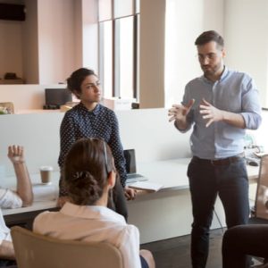 Multiethnic staff listen to boss instruct